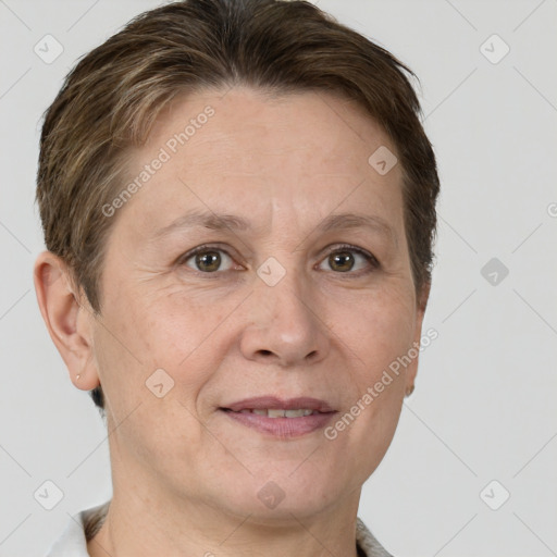 Joyful white adult female with short  brown hair and grey eyes