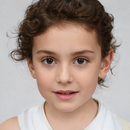 Joyful white child female with medium  brown hair and brown eyes