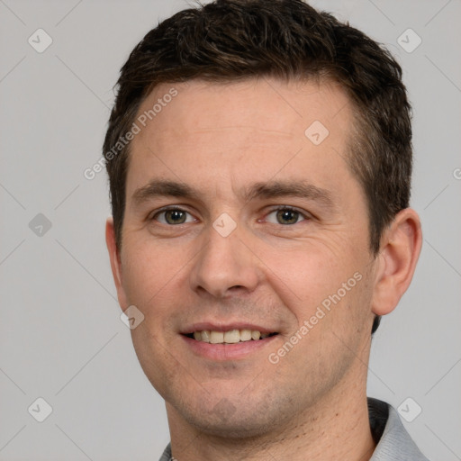 Joyful white young-adult male with short  brown hair and brown eyes