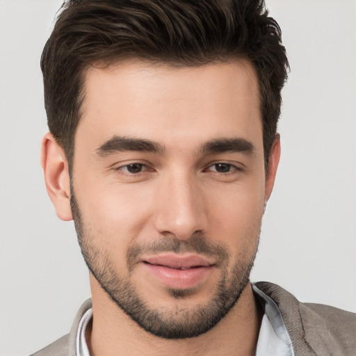 Joyful white young-adult male with short  brown hair and brown eyes