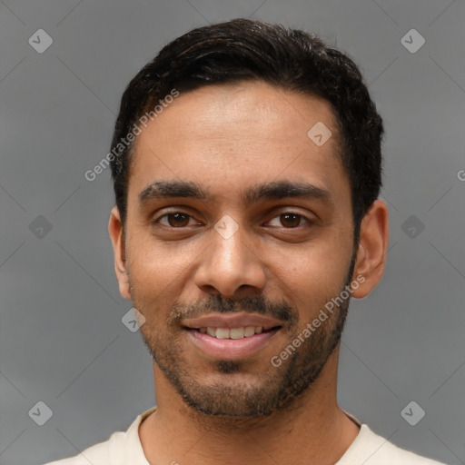 Joyful latino young-adult male with short  black hair and brown eyes