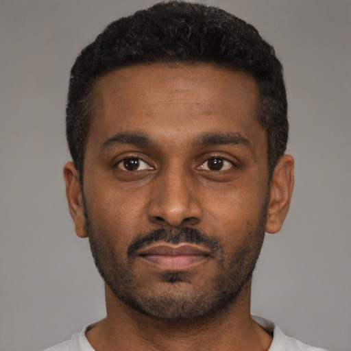 Neutral black young-adult male with short  black hair and brown eyes