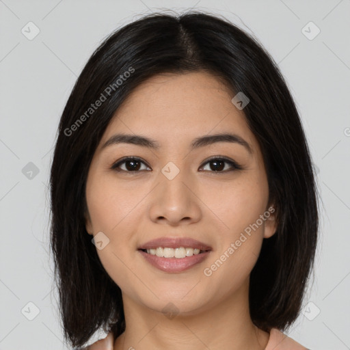 Joyful asian young-adult female with long  brown hair and brown eyes