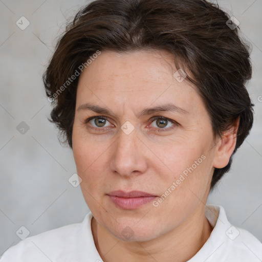 Joyful white adult female with short  brown hair and brown eyes