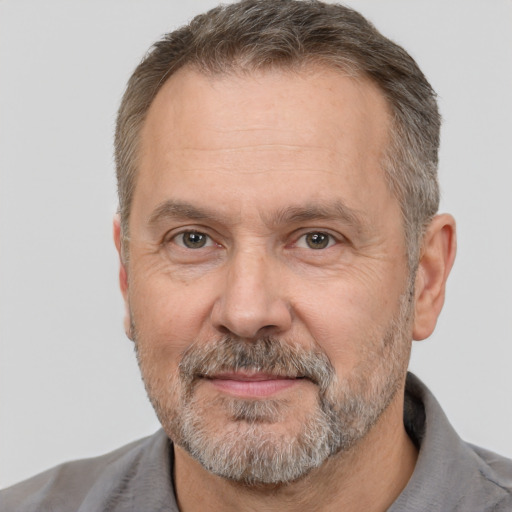 Joyful white middle-aged male with short  brown hair and brown eyes