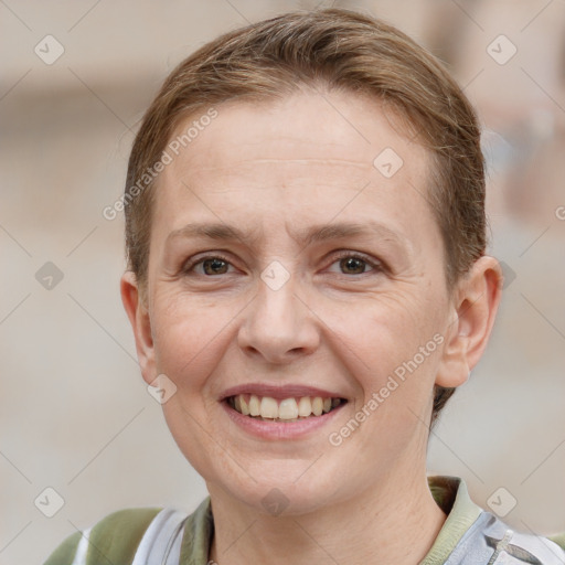 Joyful white adult female with short  brown hair and grey eyes