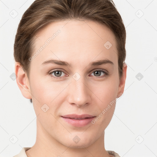 Joyful white young-adult female with short  brown hair and grey eyes