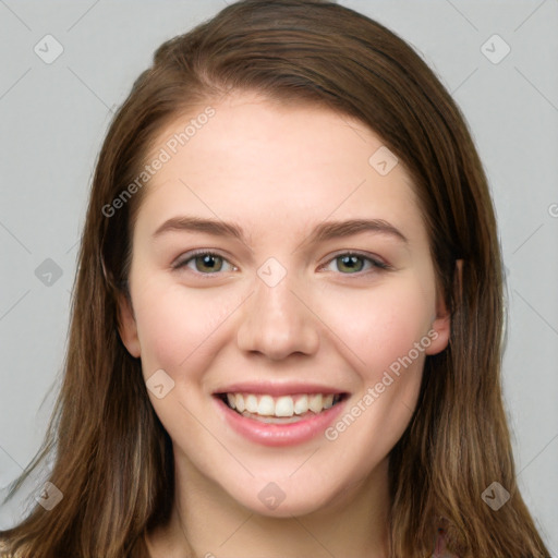 Joyful white young-adult female with long  brown hair and grey eyes