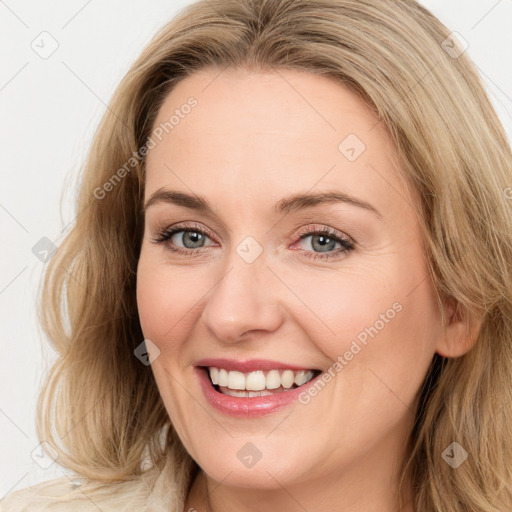 Joyful white young-adult female with medium  brown hair and blue eyes