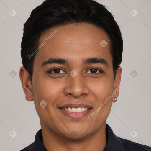 Joyful white young-adult male with short  black hair and brown eyes