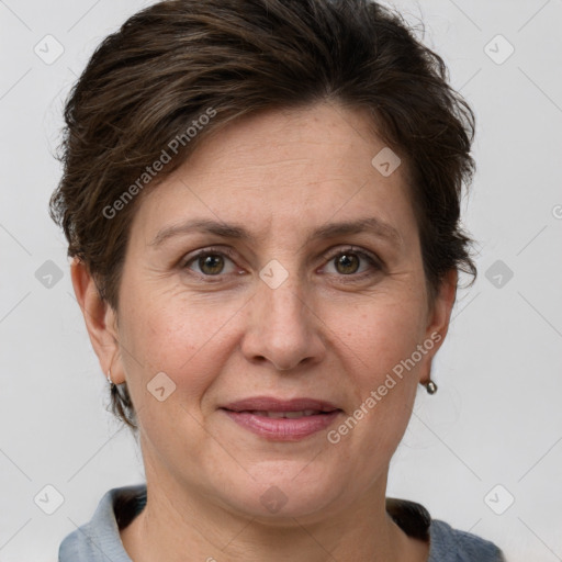 Joyful white adult female with short  brown hair and grey eyes