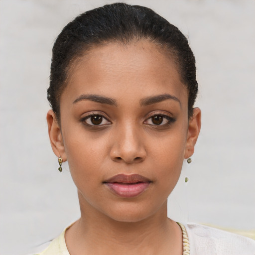 Joyful latino young-adult female with short  brown hair and brown eyes