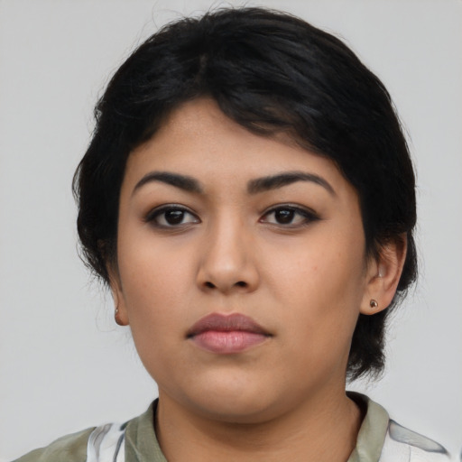 Neutral latino young-adult female with medium  black hair and brown eyes