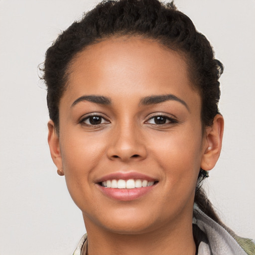 Joyful white young-adult female with short  brown hair and brown eyes