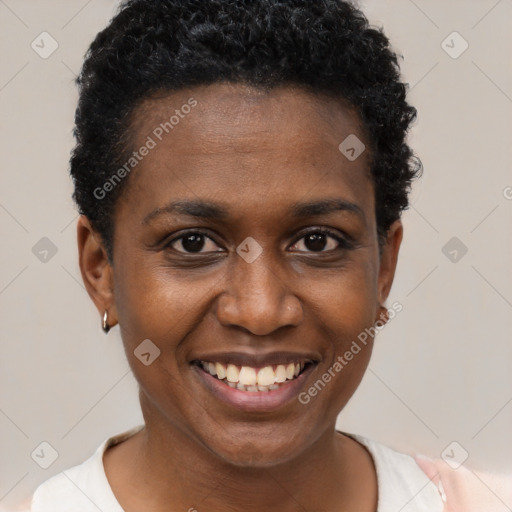 Joyful black young-adult female with short  brown hair and brown eyes