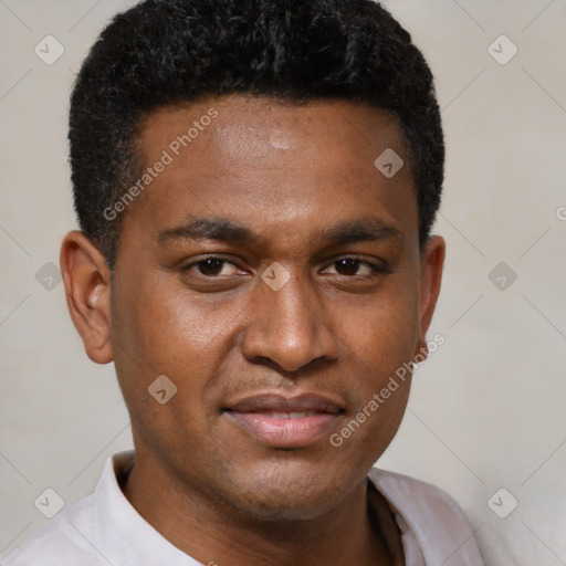Joyful black young-adult male with short  brown hair and brown eyes