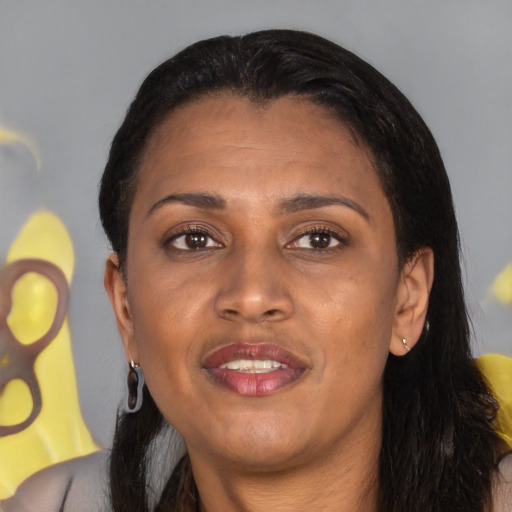 Joyful latino adult female with long  black hair and brown eyes