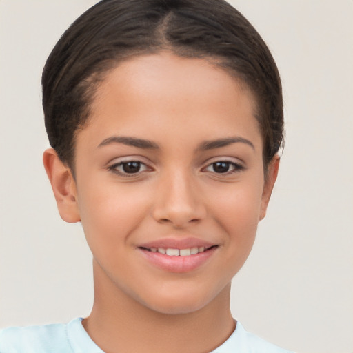 Joyful white child female with short  brown hair and brown eyes