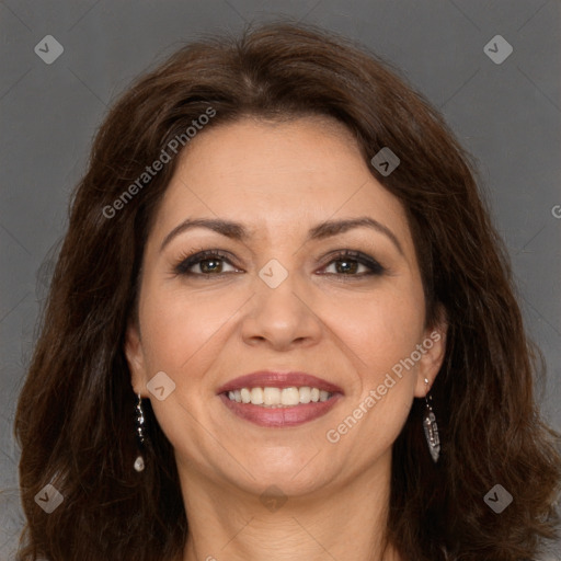 Joyful white adult female with long  brown hair and brown eyes