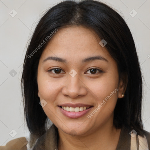 Joyful latino young-adult female with medium  brown hair and brown eyes