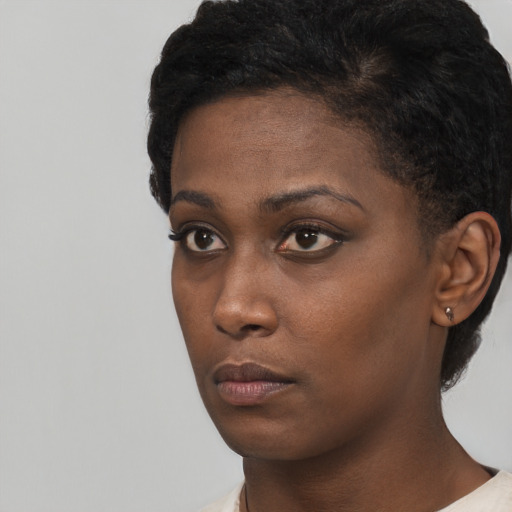 Neutral black young-adult female with short  black hair and brown eyes