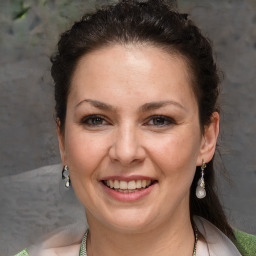 Joyful white adult female with short  brown hair and brown eyes