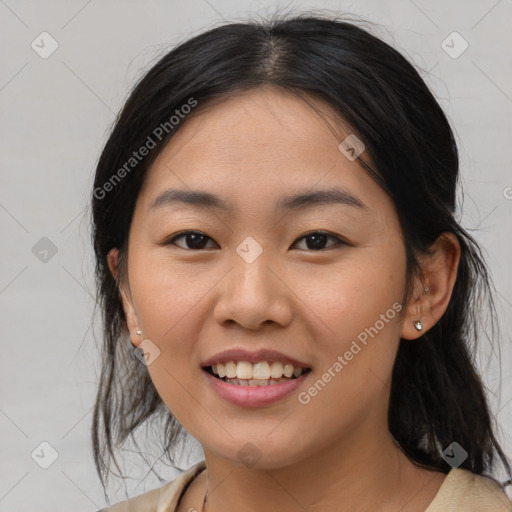 Joyful asian young-adult female with medium  black hair and brown eyes