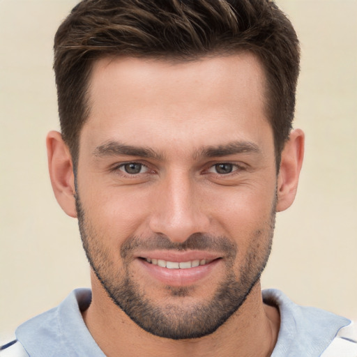 Joyful white young-adult male with short  brown hair and brown eyes