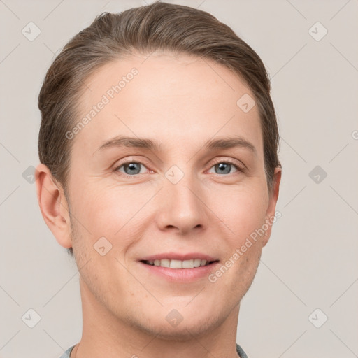 Joyful white young-adult female with short  brown hair and grey eyes