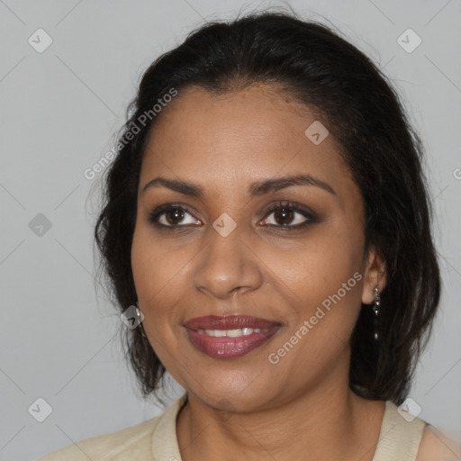 Joyful black adult female with medium  brown hair and brown eyes