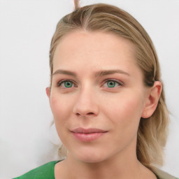 Joyful white young-adult female with medium  brown hair and green eyes