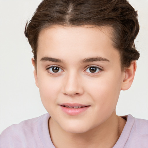 Joyful white child female with short  brown hair and brown eyes