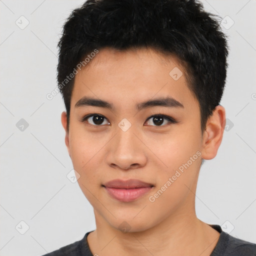 Joyful asian young-adult male with short  brown hair and brown eyes