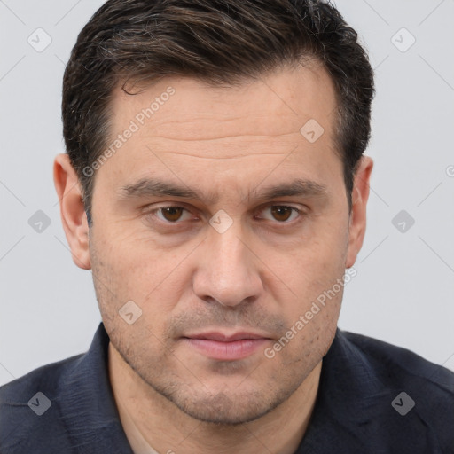 Joyful white adult male with short  brown hair and brown eyes