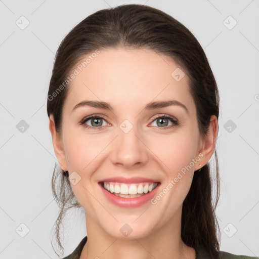 Joyful white young-adult female with medium  brown hair and grey eyes