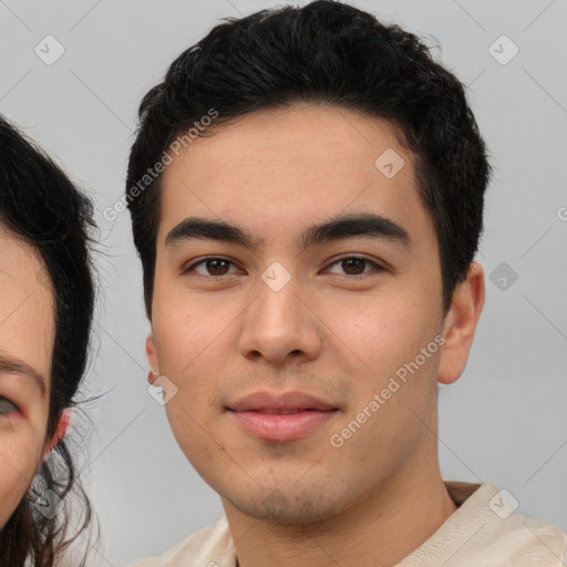 Neutral white young-adult male with short  black hair and brown eyes