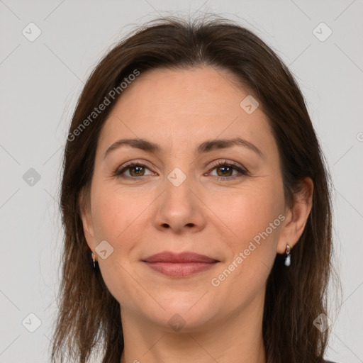 Joyful white adult female with medium  brown hair and brown eyes