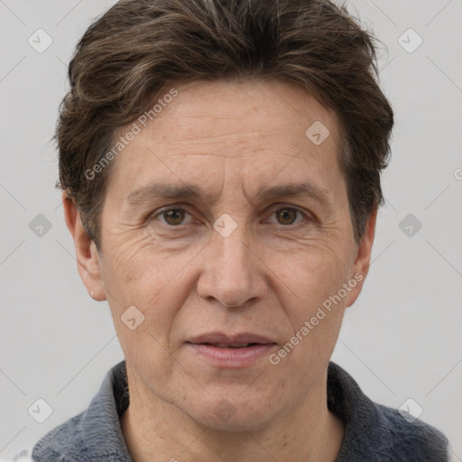Joyful white adult male with short  brown hair and grey eyes