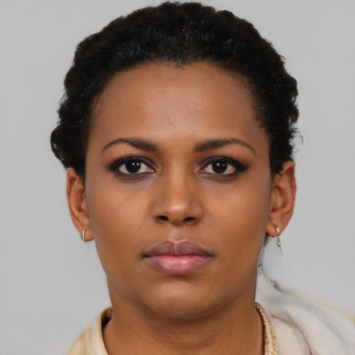 Neutral black young-adult female with short  brown hair and brown eyes