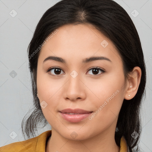 Joyful latino young-adult female with medium  brown hair and brown eyes