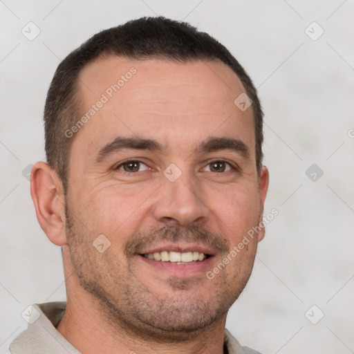 Joyful white adult male with short  brown hair and brown eyes