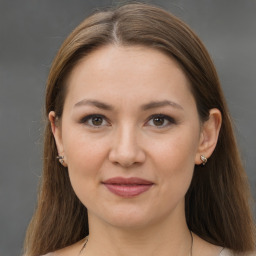 Joyful white young-adult female with long  brown hair and grey eyes