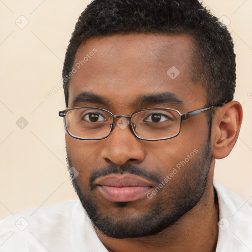 Neutral black young-adult male with short  black hair and brown eyes