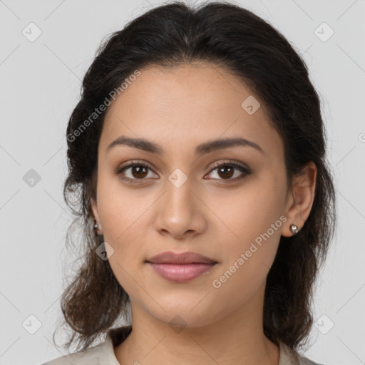 Joyful latino young-adult female with medium  brown hair and brown eyes