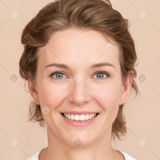 Joyful white young-adult female with medium  brown hair and green eyes