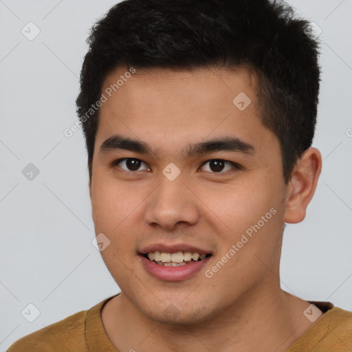 Joyful latino young-adult male with short  brown hair and brown eyes