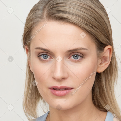 Joyful white young-adult female with long  brown hair and blue eyes