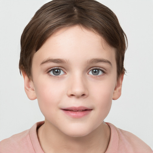 Joyful white child female with short  brown hair and grey eyes