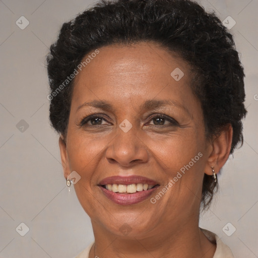 Joyful black adult female with short  brown hair and brown eyes