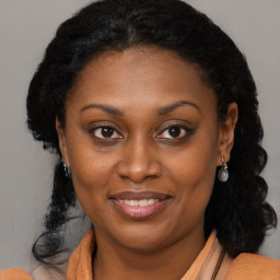 Joyful black young-adult female with medium  black hair and brown eyes